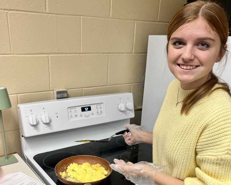 picture of a student in cold and nutrition course making eggs