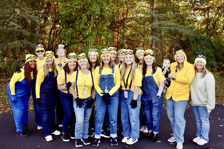 picture of cooper teachers dressed up like minions at their monster mash event