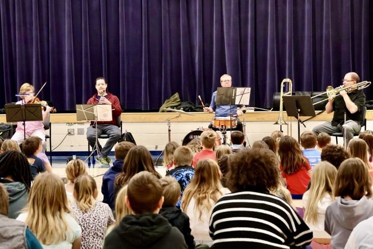picture of four musicians playing from the Kalamazoo symphony orchestra for students at Starr