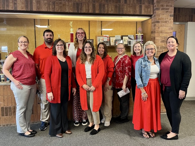 group of middle school teachers wearing red in support of red ribbon week