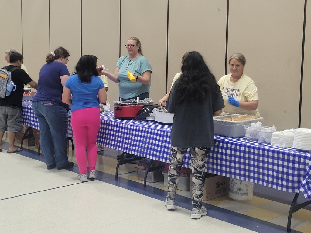 parents going through the food line at open house