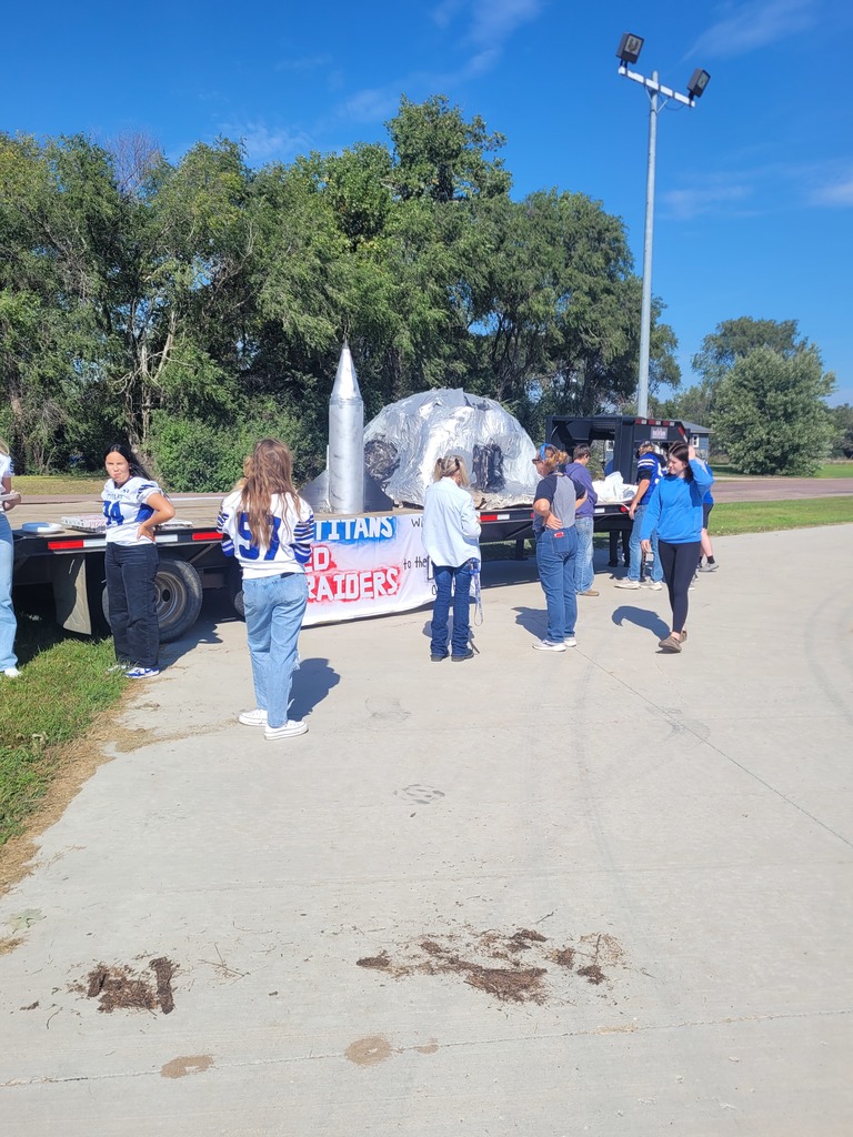 students putting the final touches on their man to the moon float