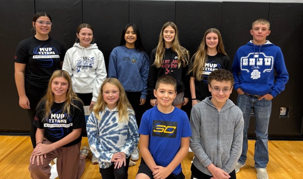 several middle school students being recognized as student of the month nominees