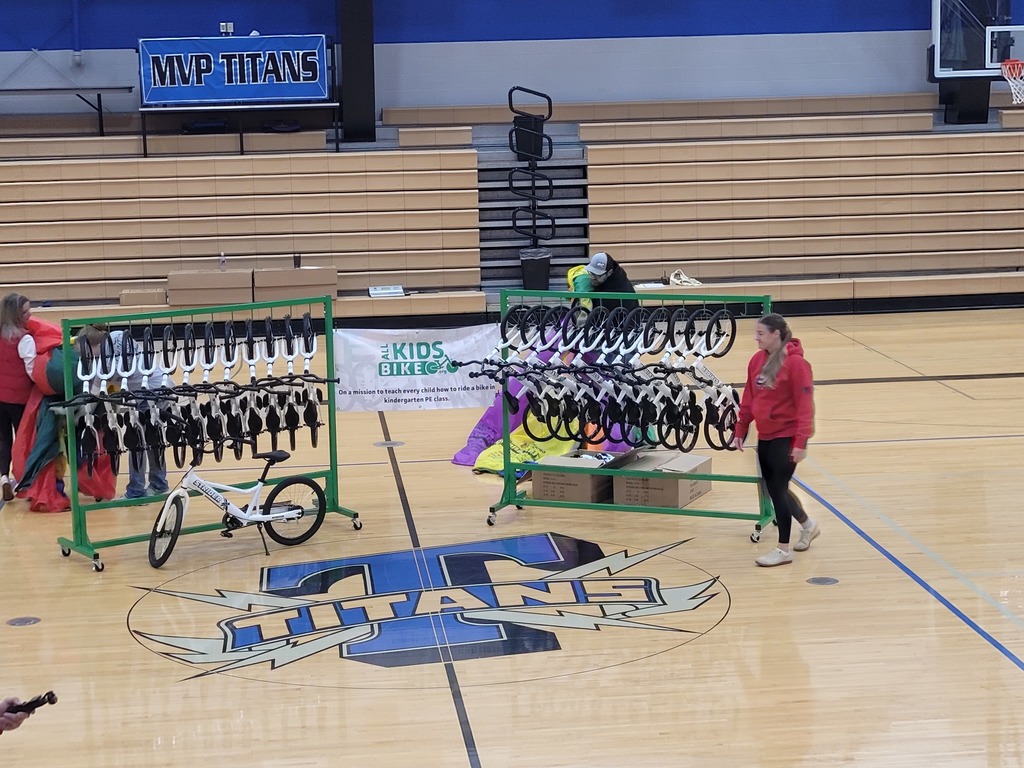 after the big reveal, all the bikes hanging from their racks
