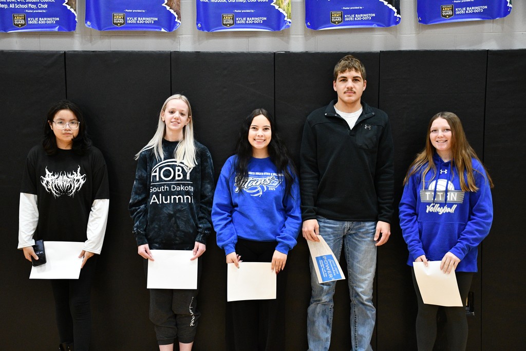 students receiving certificates for December student of the month - high school students