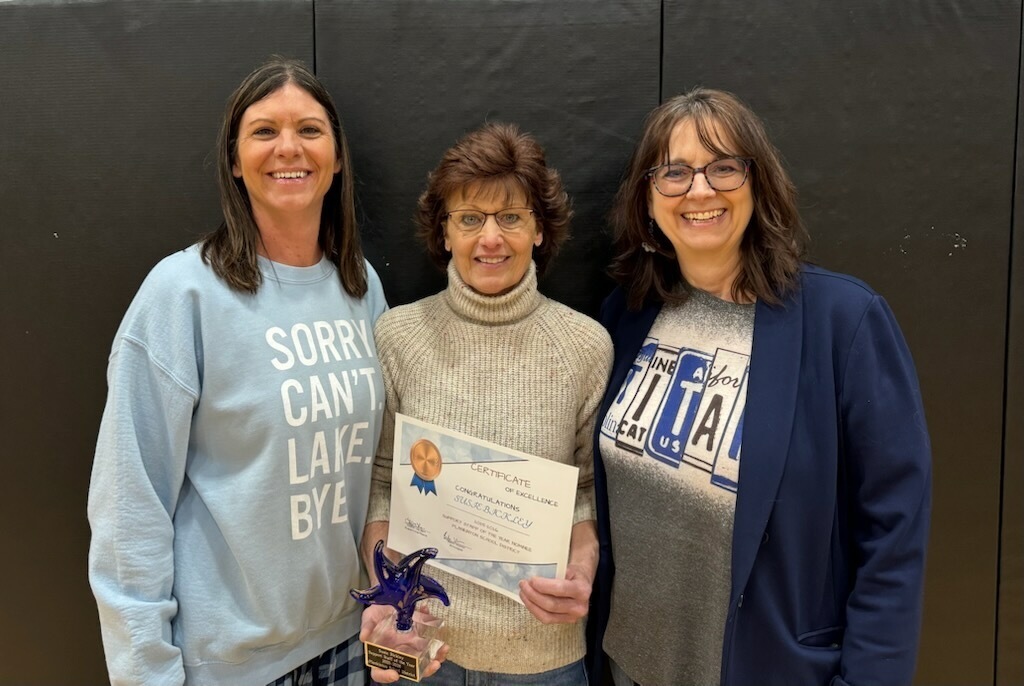 support staff of the year Susie Bickley being honored and surrounded by the principal and superintendent