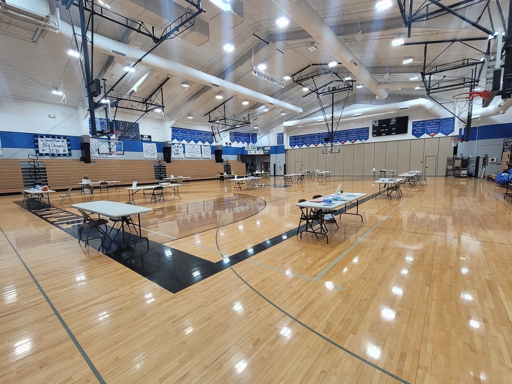 gym set up with tables and activities for Family Fun Night.