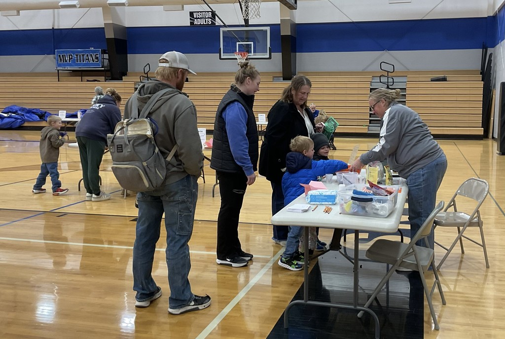 students weighing and measuring ingredients for a trail mix recipe