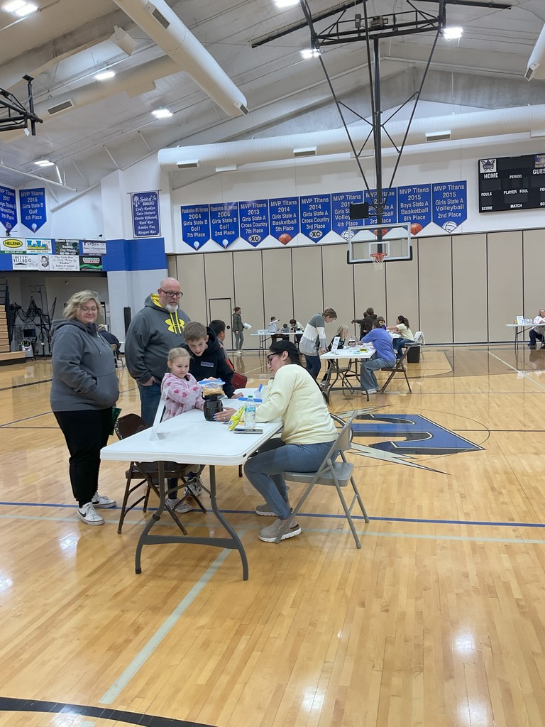 students and families guessing the weight of items and then actually weighing them to see how close they were
