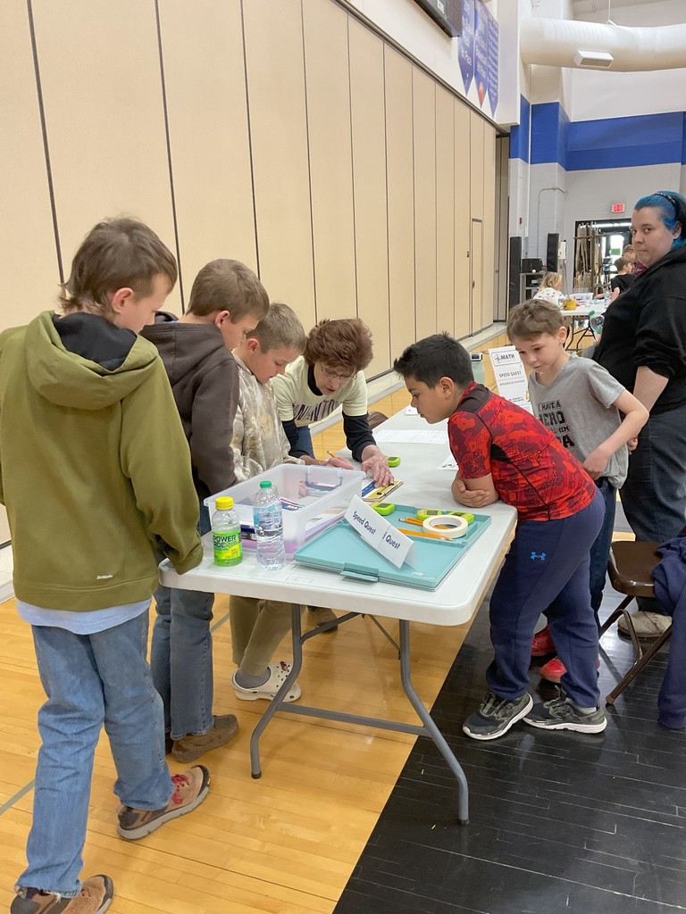 a group of students at one of the math stations