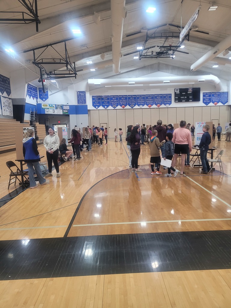 science fair participants in the gym