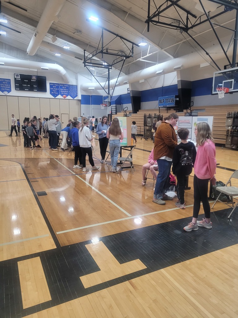 science fair participants in the gym