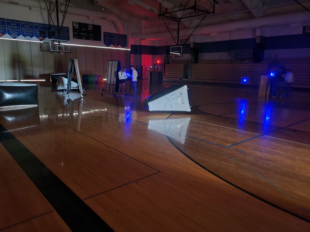 students playing laser tag in the gym