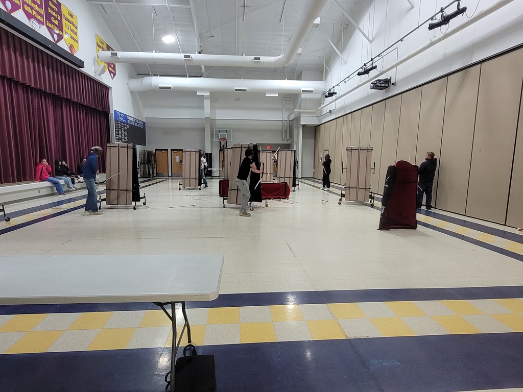 students playing archery tag in the commons