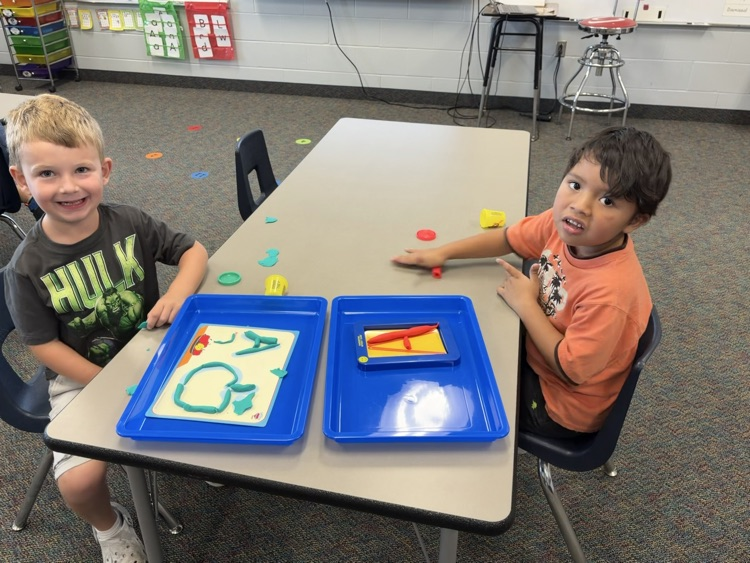 Making the letter A with playdoh