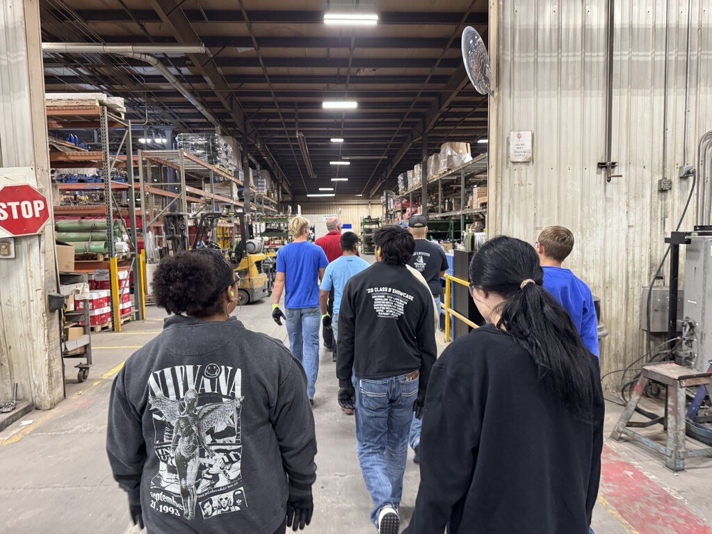 Students walking through the main shop.