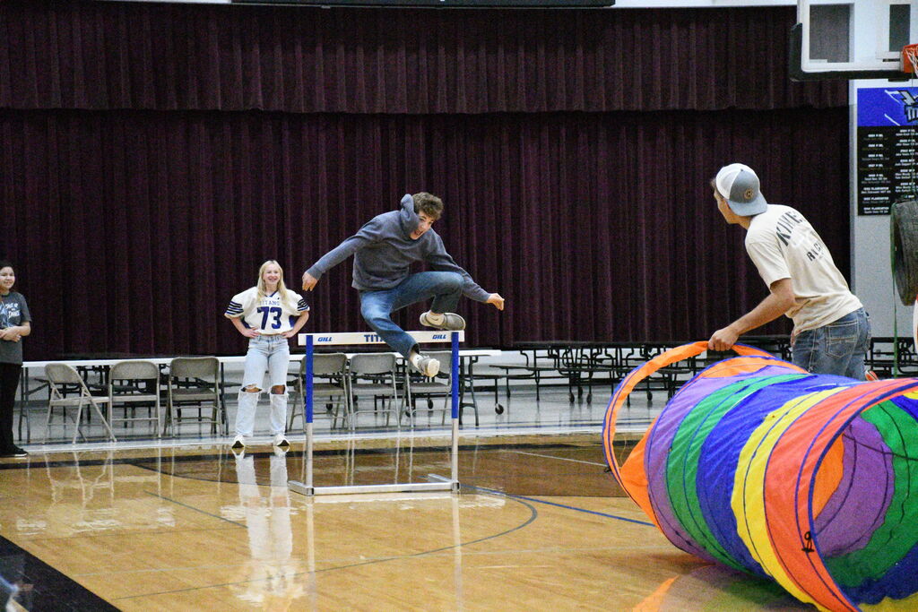 Dreyton Hoffman makes a successful hurdle jump. 