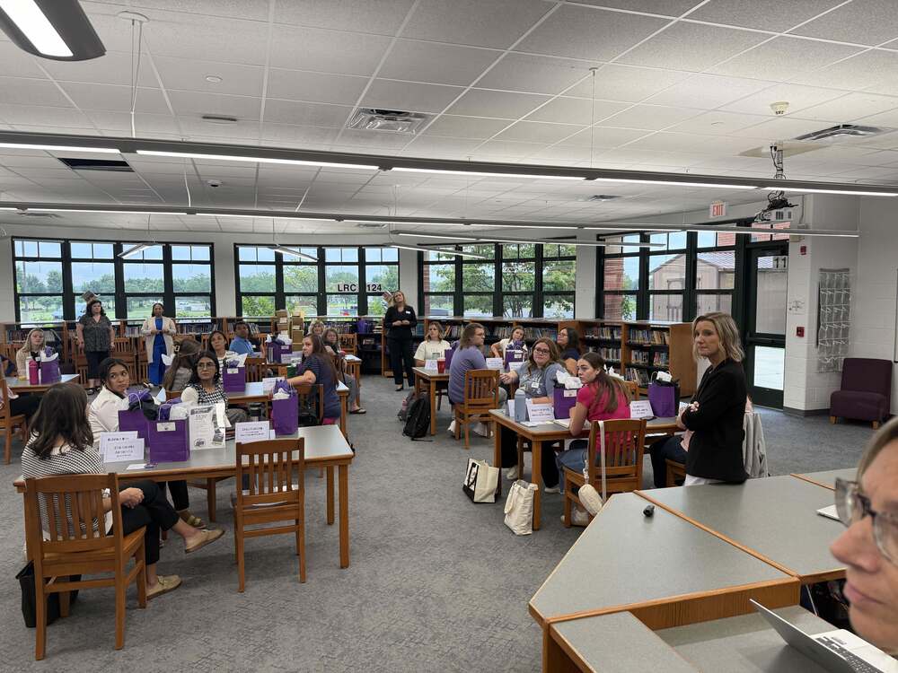 teachers in library for orientation 1