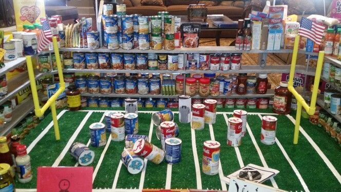 Cans of food on a football field and on shelves