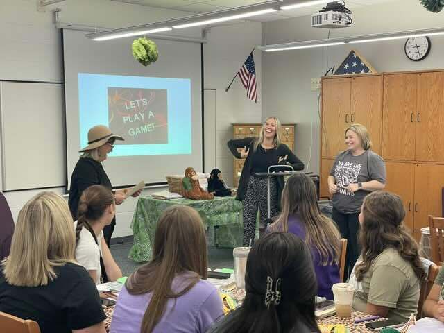 teacher in classroom playing a game