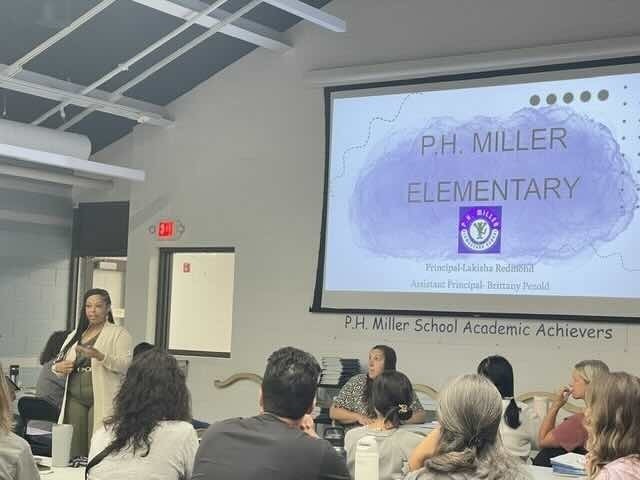 prinicpal presenting in front of staff