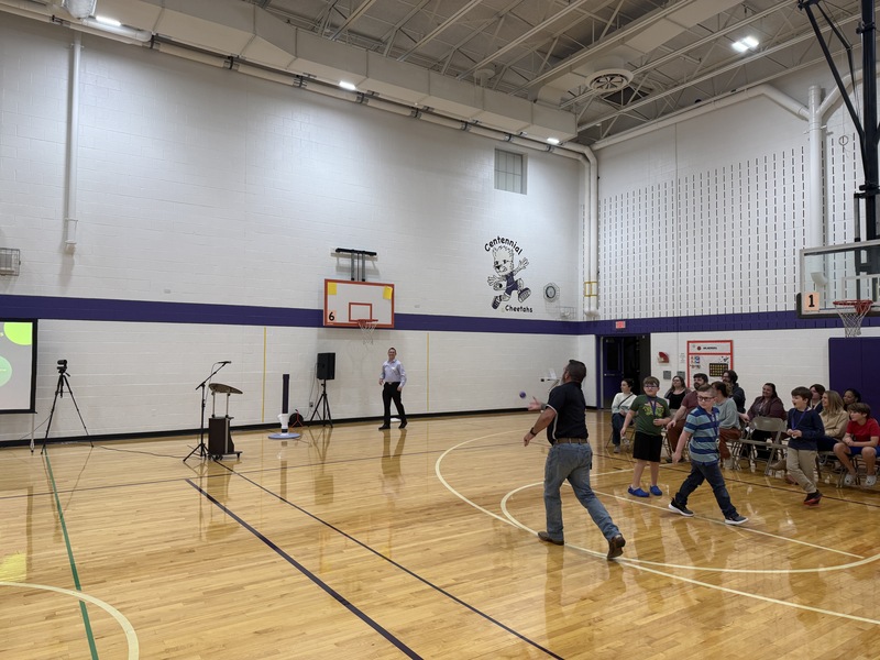 Board member Klatt tossing the ball for The Impossible Shot