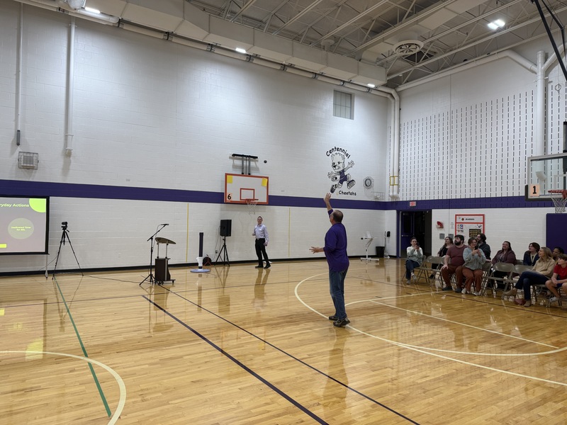 Board member Schneider tossing the ball for The Impossible Shot