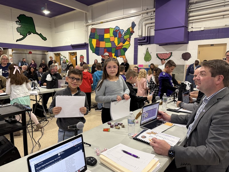 Centennial Students reading to Board members