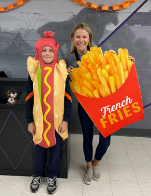 Student and teacher dressed up as hot dog and fries
