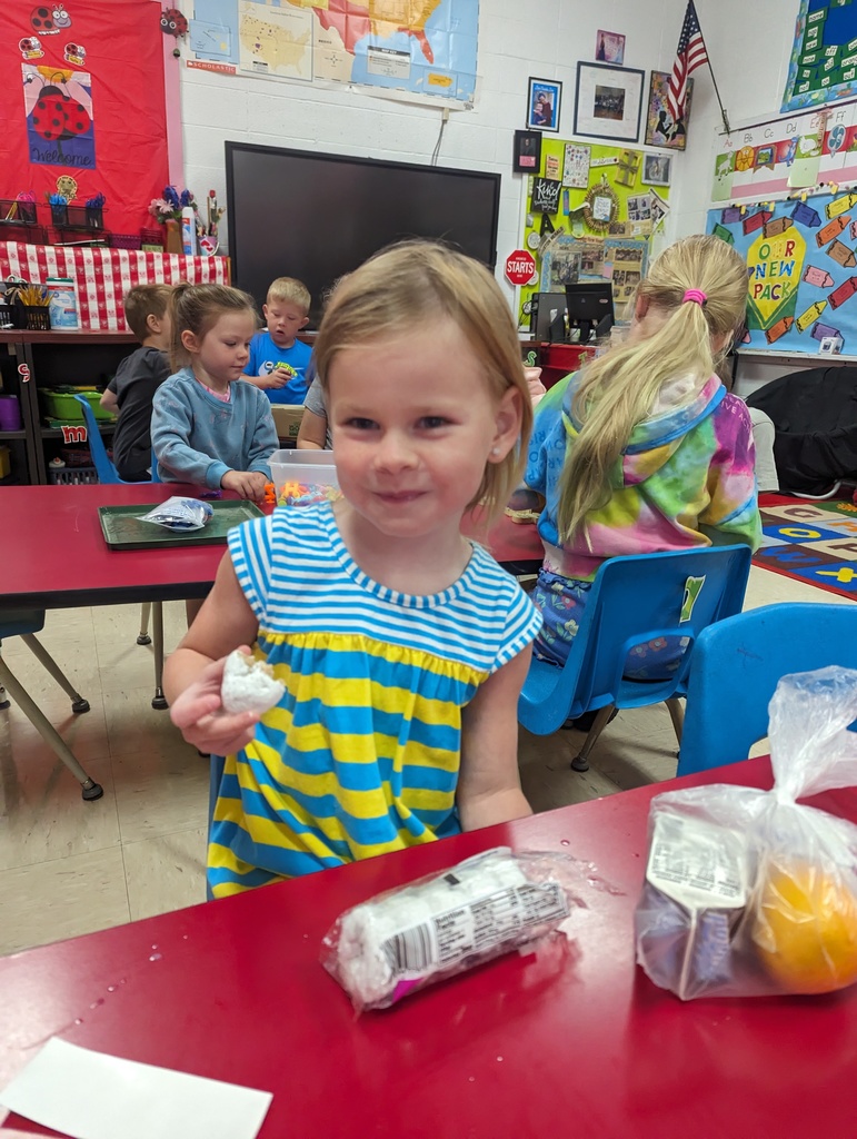 Miss Amy's kindergarten class is enjoying their free breakfast