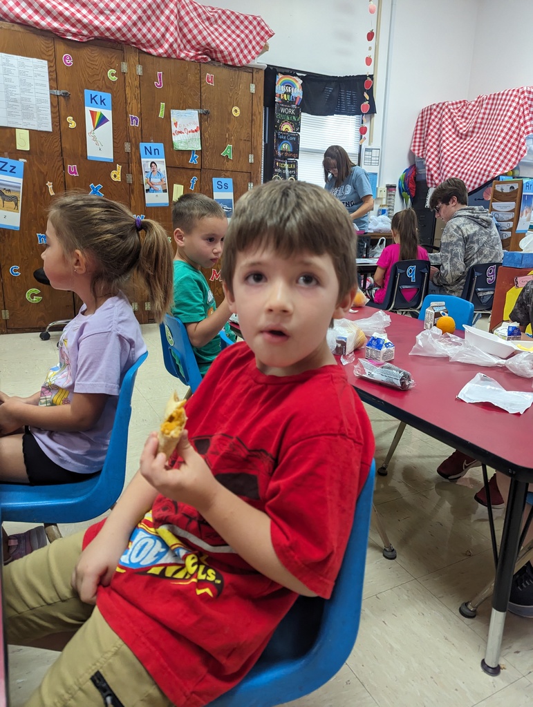 Miss Amy's kindergarten class is enjoying their free breakfast