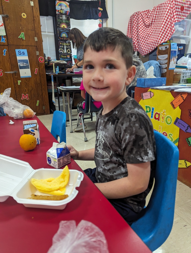 Miss Amy's kindergarten class is enjoying their free breakfast