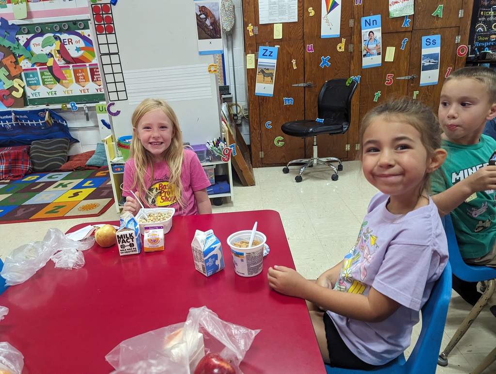 Miss Amy's kindergarten class is enjoying their free breakfast