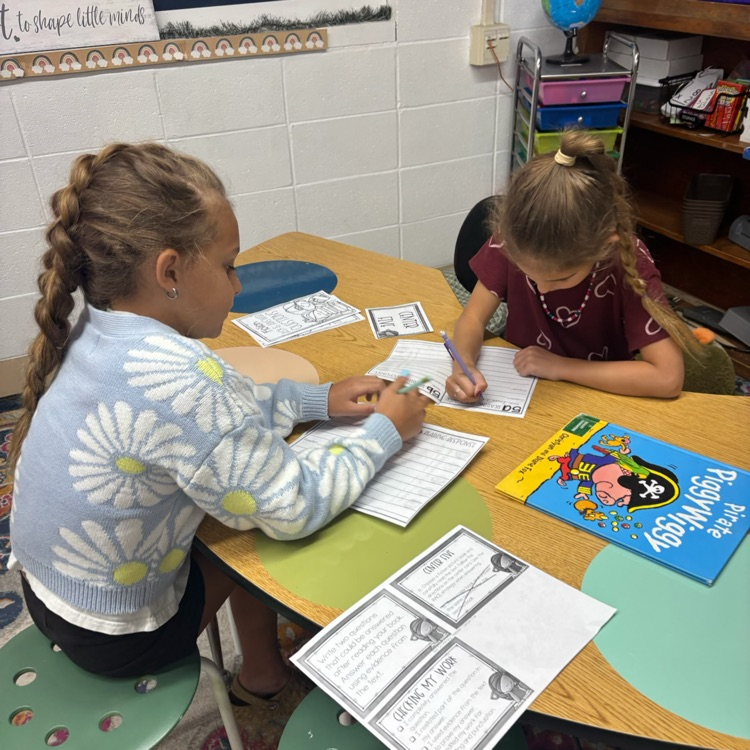 Mrs. Collier’s 3rd graders rotated through different stations and used the RACE strategy to answer response questions. 