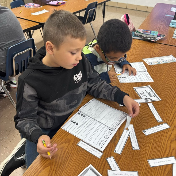 Mrs. Collier’s 3rd graders rotated through different stations and used the RACE strategy to answer response questions. 