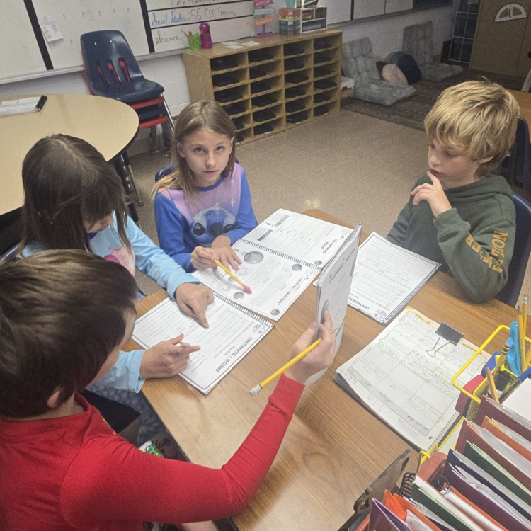Mrs. Hazelwood's 4th grade students worked together to identify evidence within a text to help them complete guided notes for a social studies test.