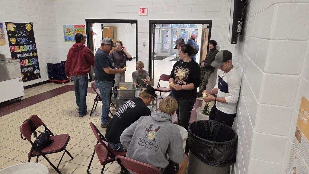Senior Ag students shucking corn pic 2