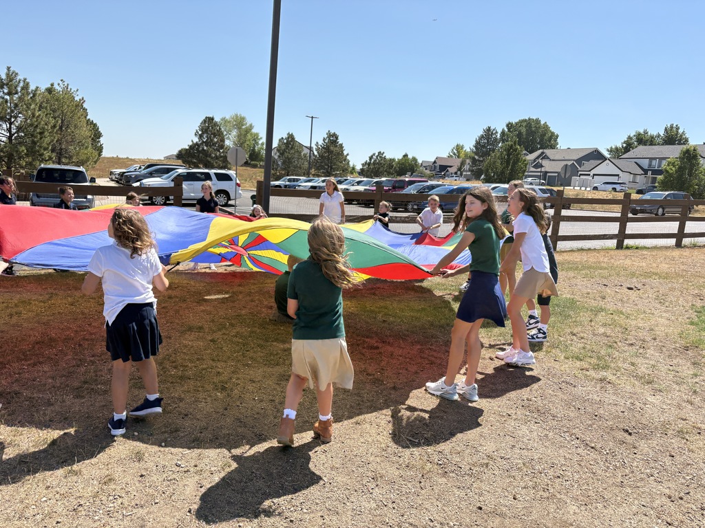 Outdoor play with parachute