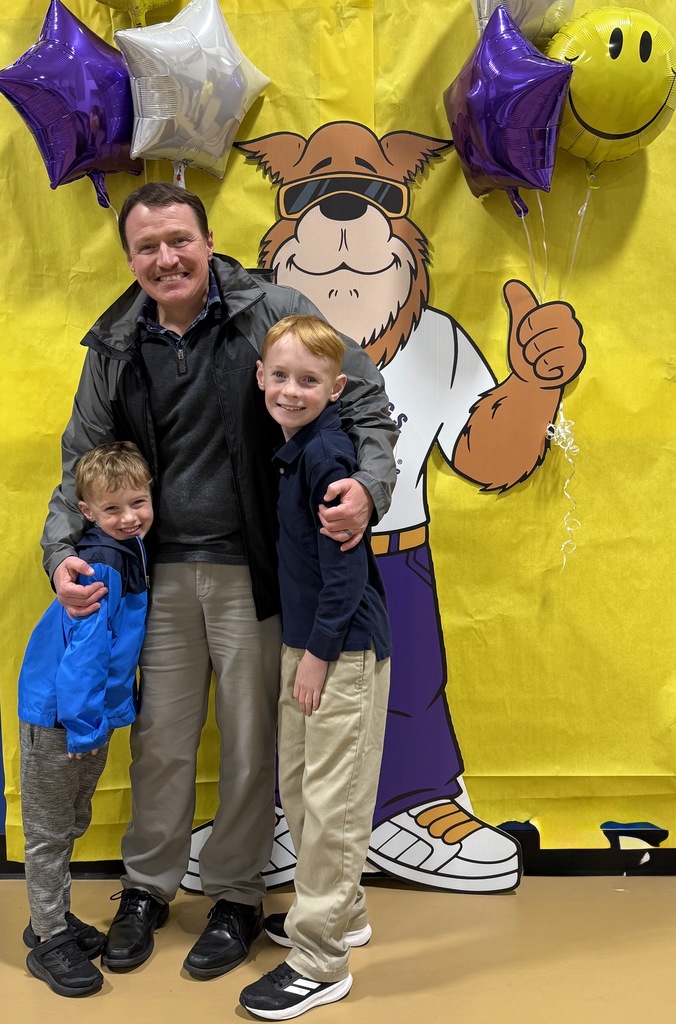 dad and sons with Watch Dog Mascot