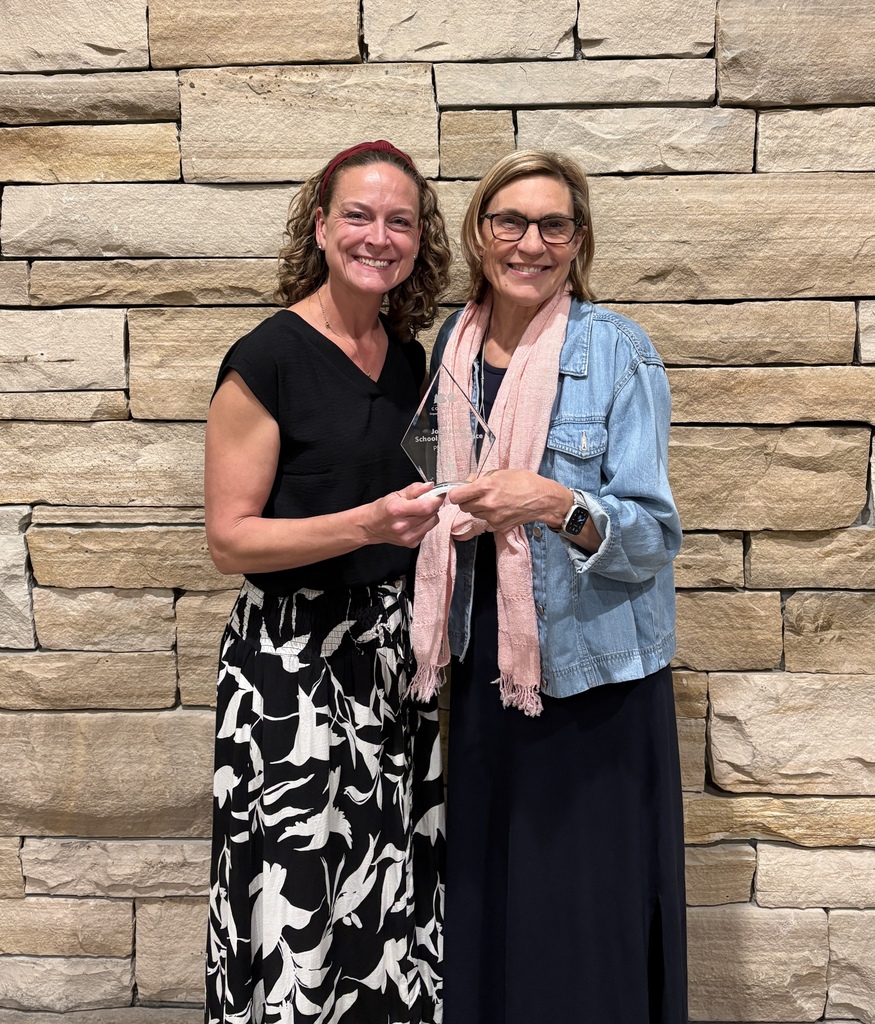 Mrs. Price & Mrs. Peterson accepting the John Irwin award