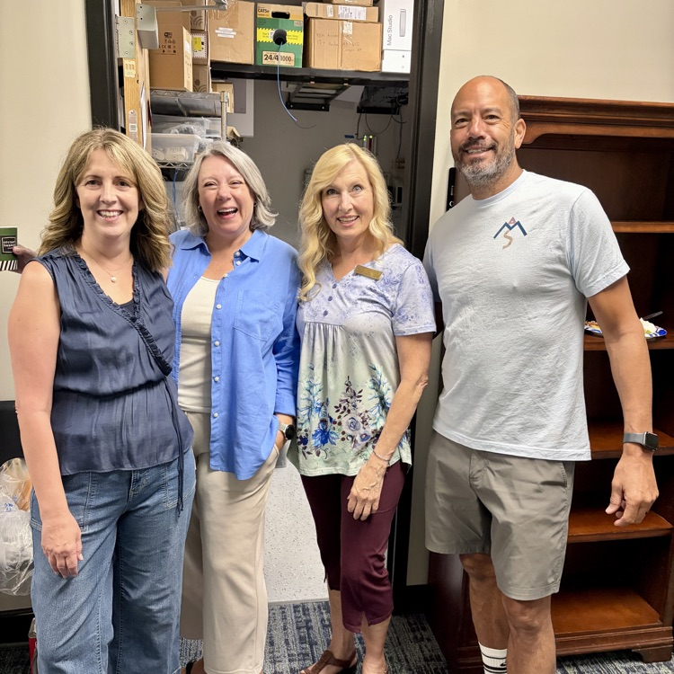 4 teachers smiling at camera  