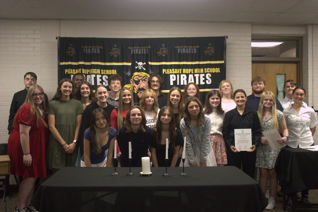 NHS members holding certificates.