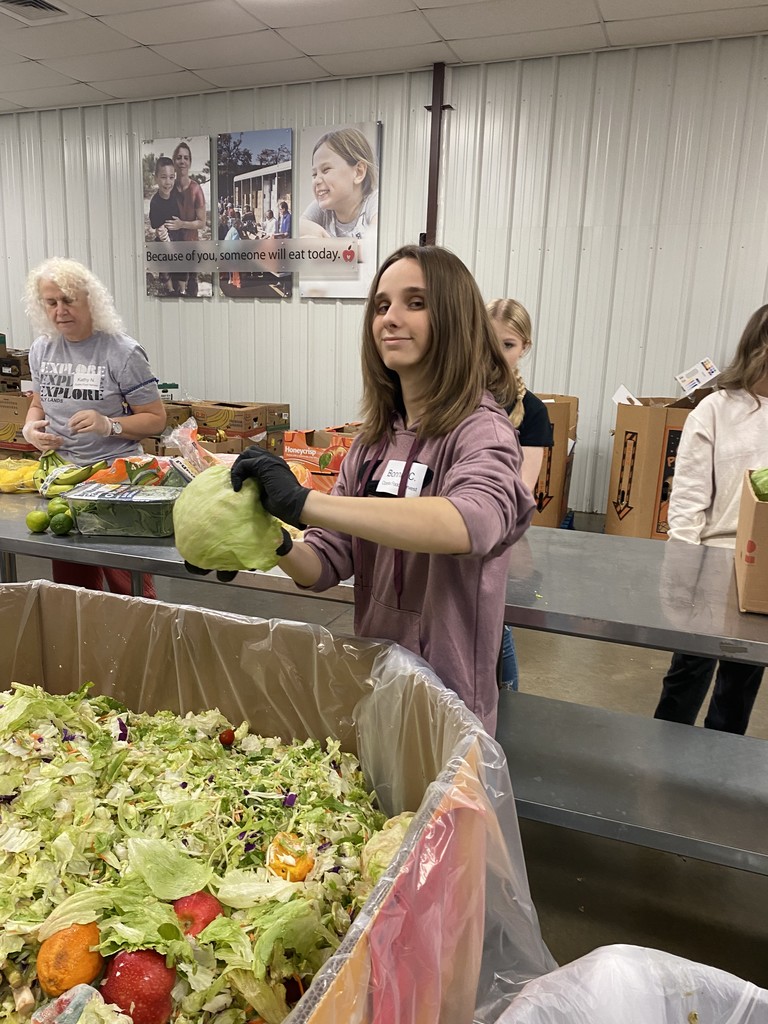 A student packs food. 
