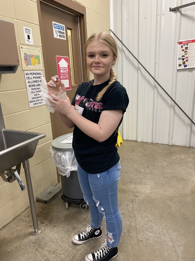 Student washes hands. 