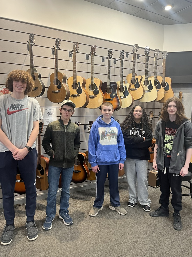 Guitar students in Ernie Williamson music center