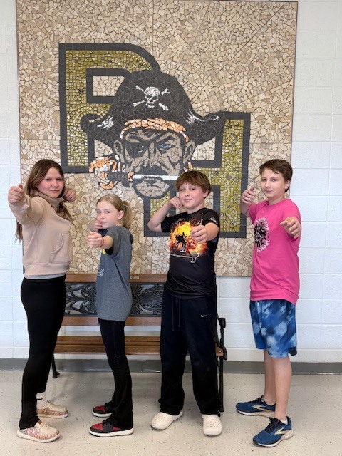 Four PHMS student archers getting ready for state competition