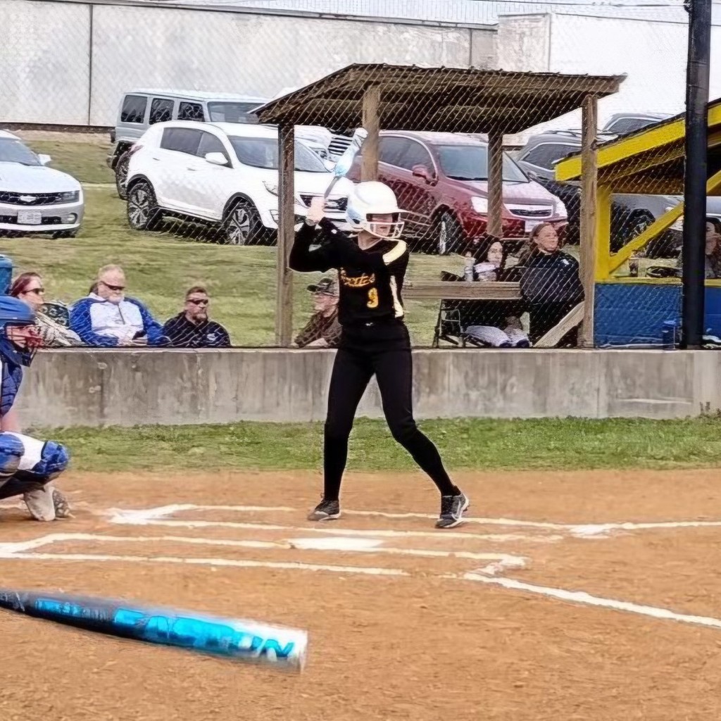 softball player up to bat