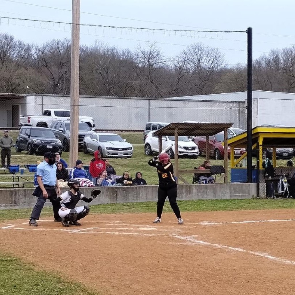 softball player up to bat
