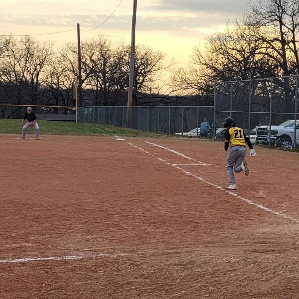 baseball player running to 1st base