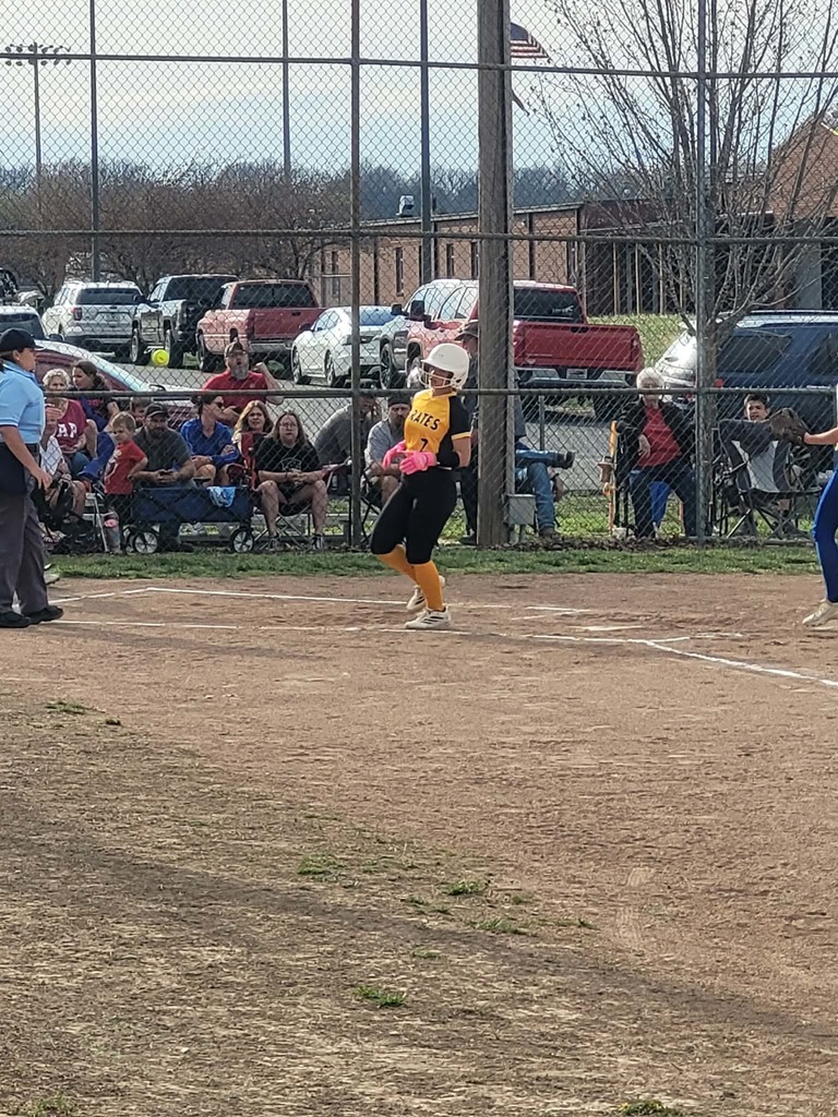 ms softball player scoring a run